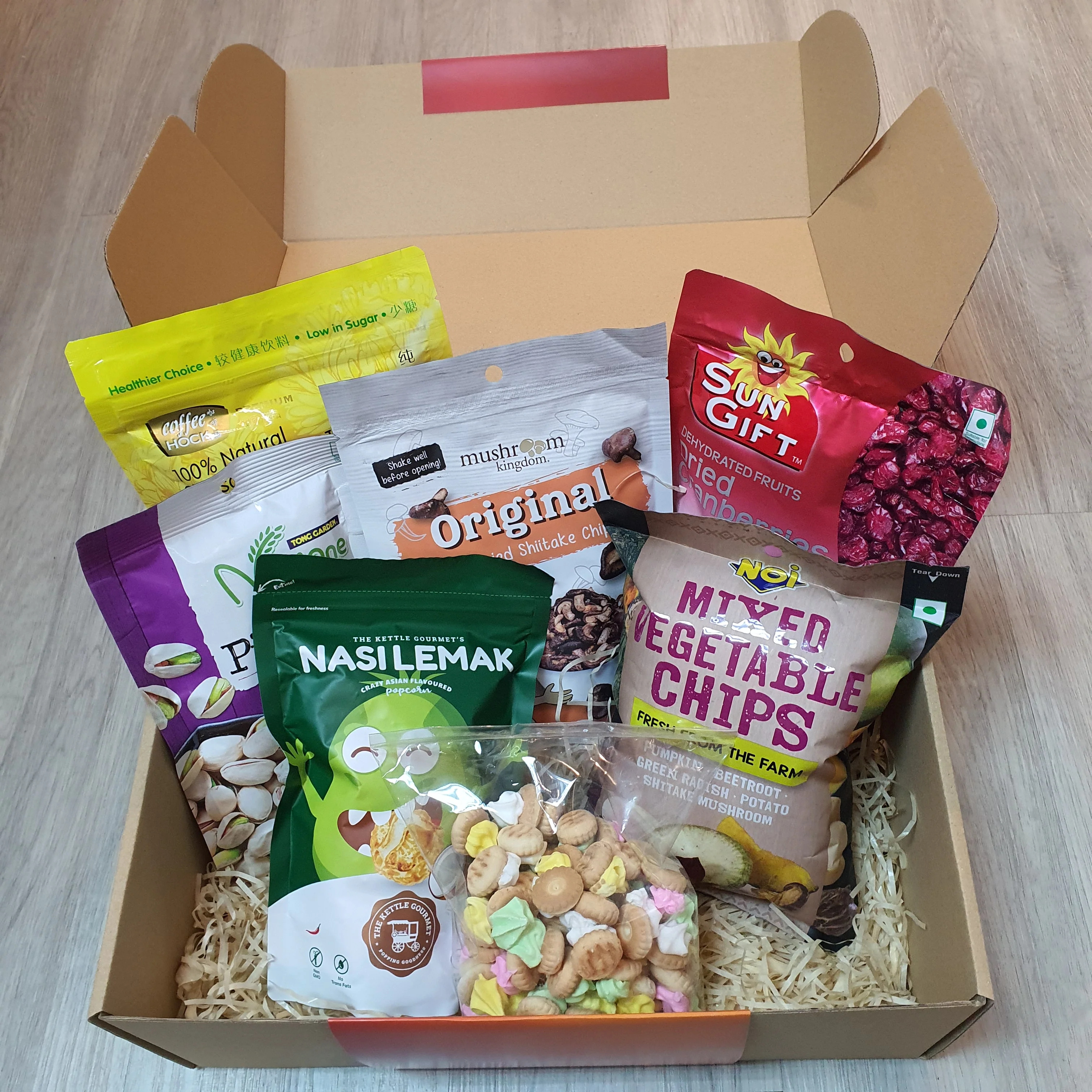 A curated Mari Makan snack box with international treats